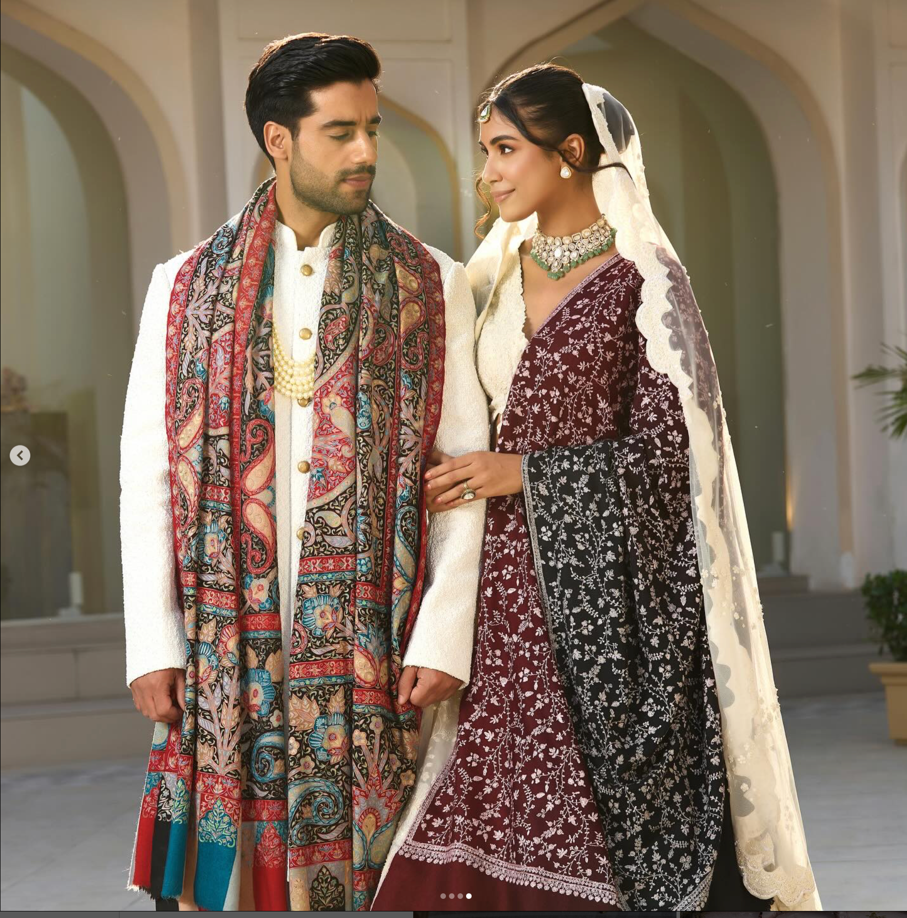A bride and groom in wedding outfits